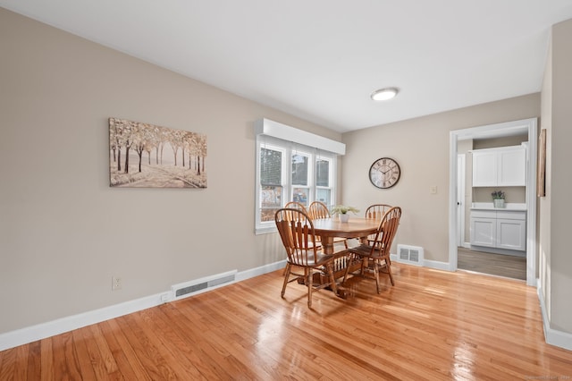 dining room with light wood-type flooring