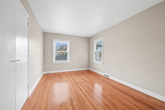 unfurnished room with light hardwood / wood-style flooring