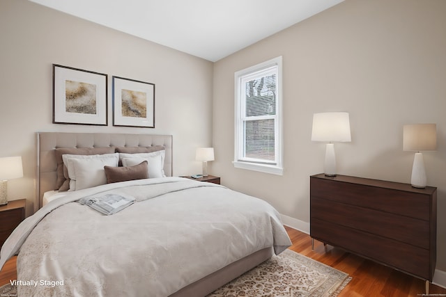 bedroom featuring hardwood / wood-style flooring