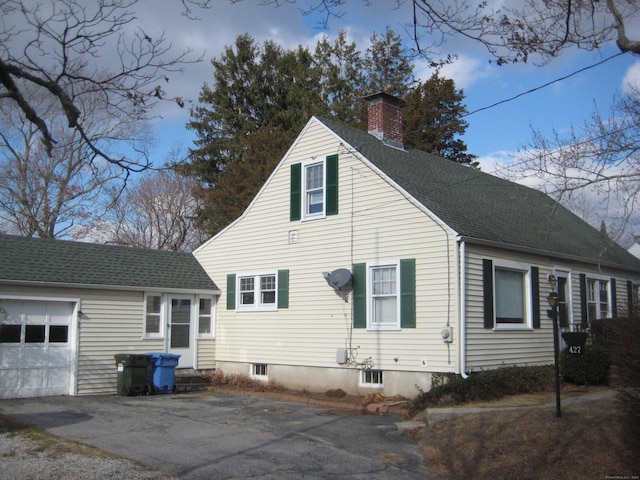 view of property exterior with a garage