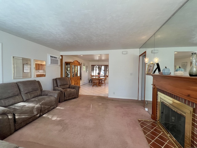 carpeted living room featuring a textured ceiling, an AC wall unit, a fireplace, and a baseboard heating unit