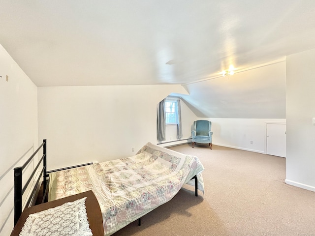 bedroom featuring carpet flooring, a baseboard heating unit, and vaulted ceiling