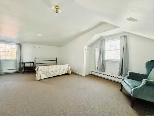 carpeted bedroom with vaulted ceiling, baseboard heating, and multiple windows