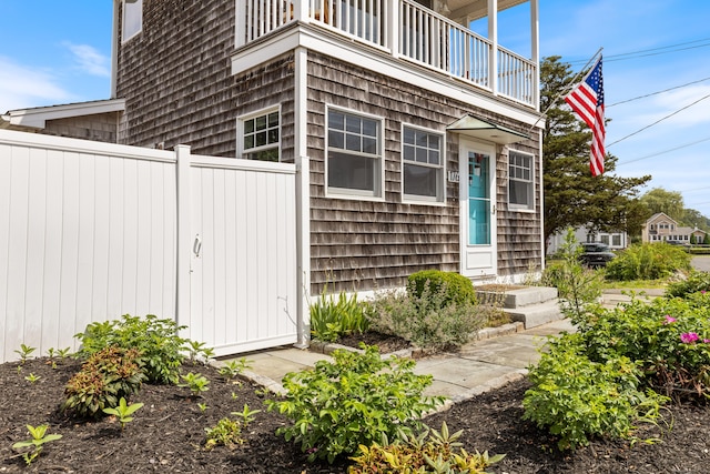 entrance to property with a balcony