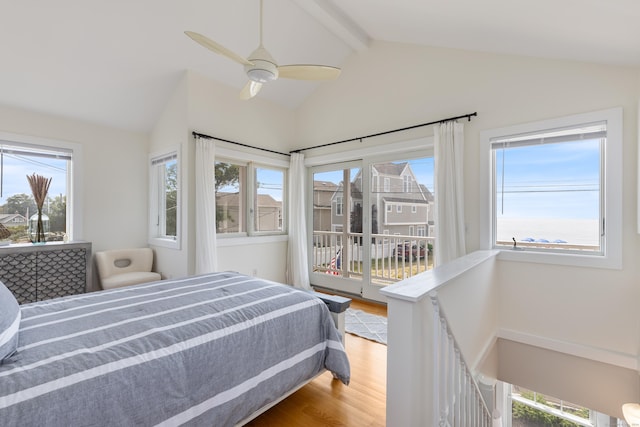 bedroom with wood-type flooring, access to outside, multiple windows, and ceiling fan