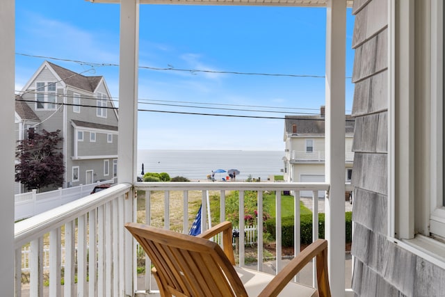 balcony featuring a water view