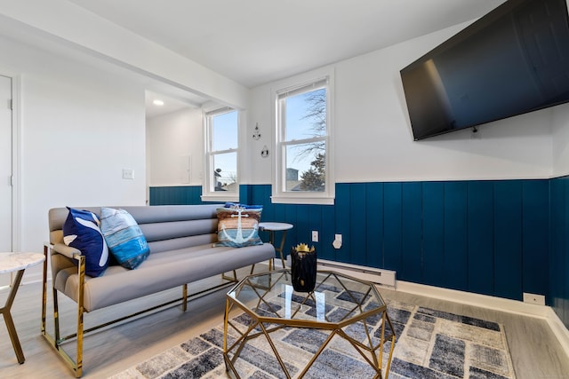 living room featuring light hardwood / wood-style floors and baseboard heating