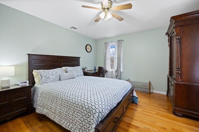 bedroom with light hardwood / wood-style floors and ceiling fan