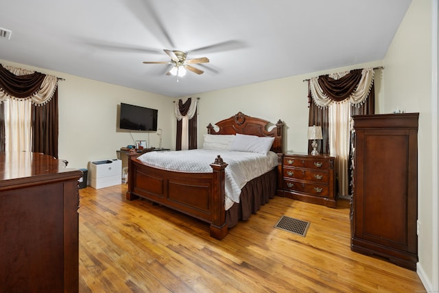 bedroom with ceiling fan and light hardwood / wood-style flooring