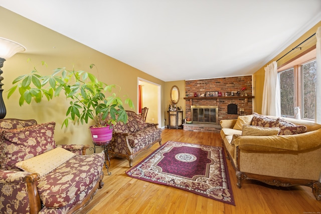 living room with a fireplace and hardwood / wood-style flooring