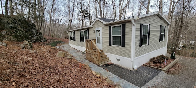 view of front of home featuring crawl space