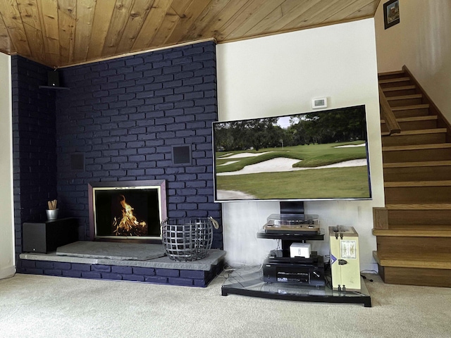 carpeted living room featuring an outdoor brick fireplace and wood ceiling