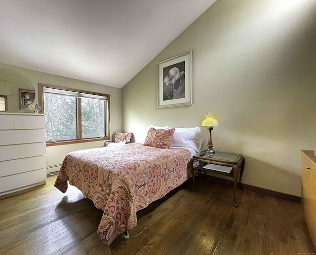 bedroom with dark hardwood / wood-style flooring, vaulted ceiling, and a baseboard heating unit