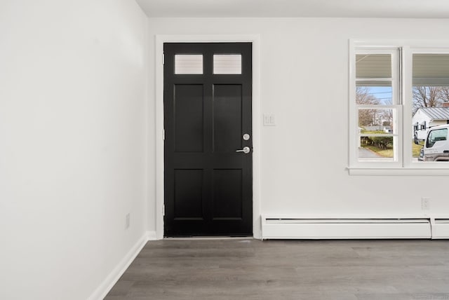 foyer featuring hardwood / wood-style flooring and a baseboard radiator