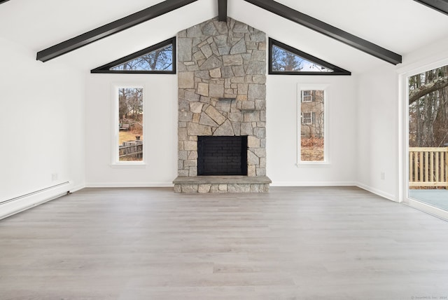 unfurnished living room featuring a fireplace, beam ceiling, and light hardwood / wood-style floors