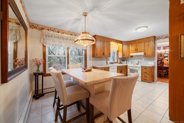 kitchen with pendant lighting, a baseboard radiator, white appliances, and light tile patterned flooring