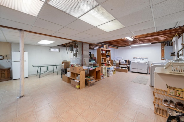 basement with white fridge and electric panel