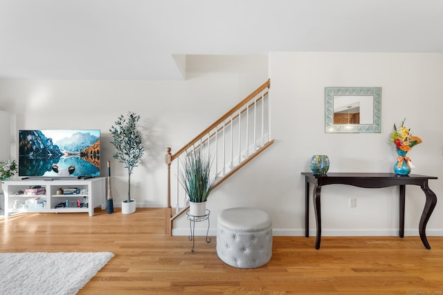 stairs with hardwood / wood-style flooring