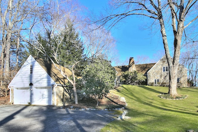 exterior space with a front yard and a garage