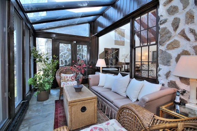 sunroom featuring vaulted ceiling