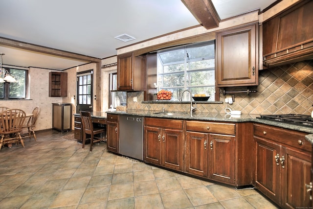 kitchen with beam ceiling, dark stone countertops, decorative backsplash, and appliances with stainless steel finishes