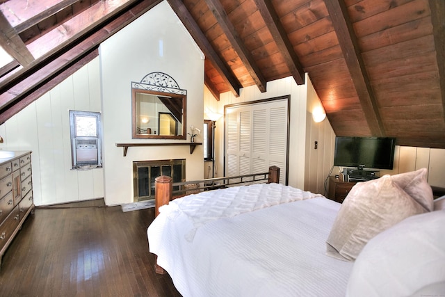 bedroom with vaulted ceiling with beams, a closet, dark hardwood / wood-style flooring, and wood ceiling