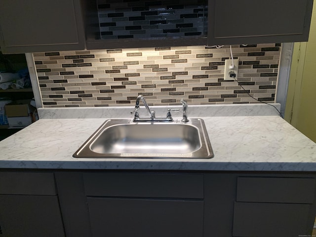 kitchen with backsplash and sink