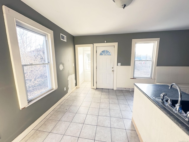 entrance foyer with light tile patterned floors