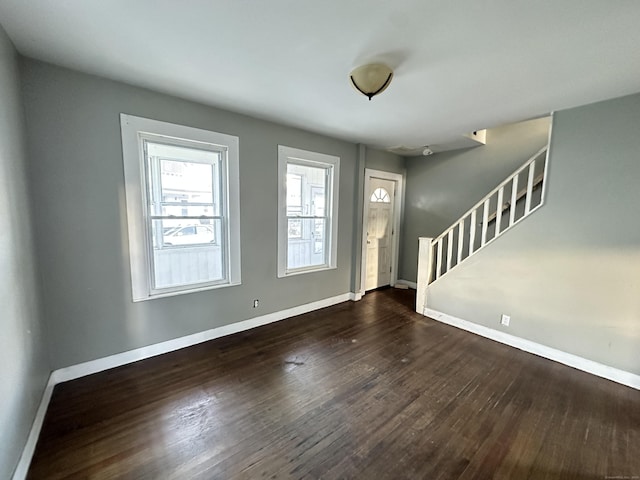 entryway with dark wood-type flooring