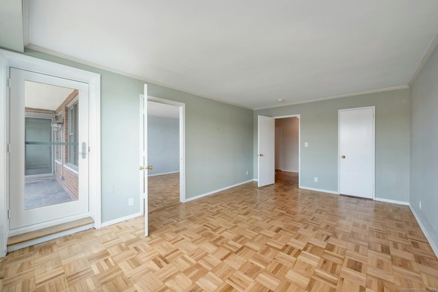 unfurnished room with ornamental molding and light parquet flooring