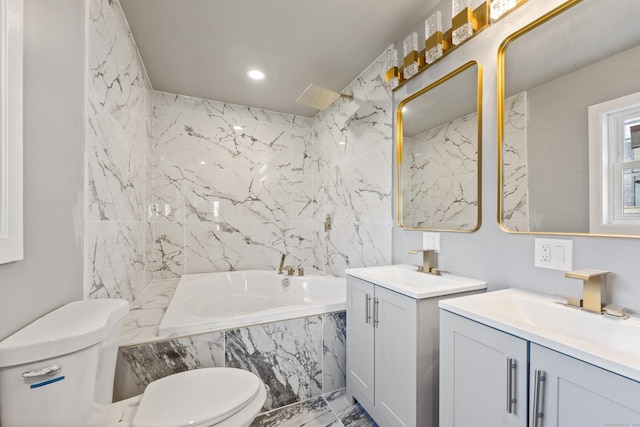 bathroom with a relaxing tiled tub, toilet, and vanity