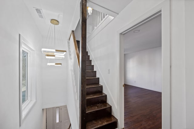 stairs with wood-type flooring