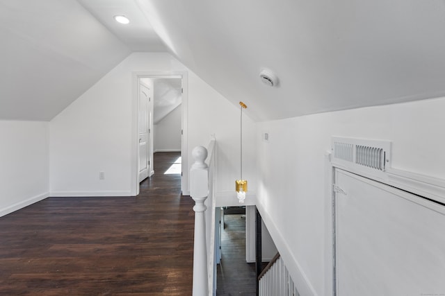 interior space featuring hardwood / wood-style flooring and vaulted ceiling