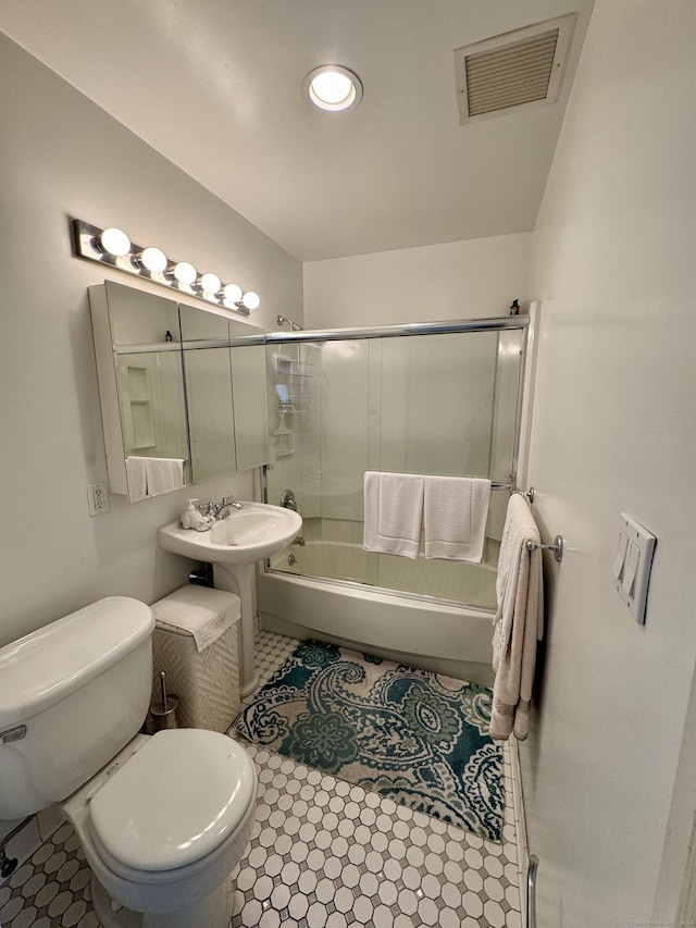 full bathroom with tile patterned flooring, toilet, tub / shower combination, and sink