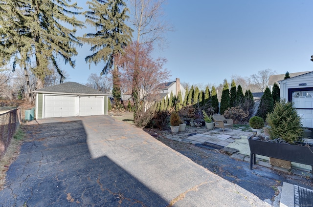 view of yard with a garage and an outdoor structure