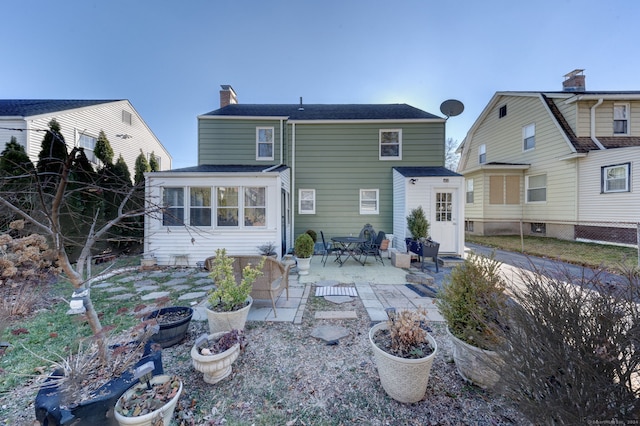 rear view of house with a patio