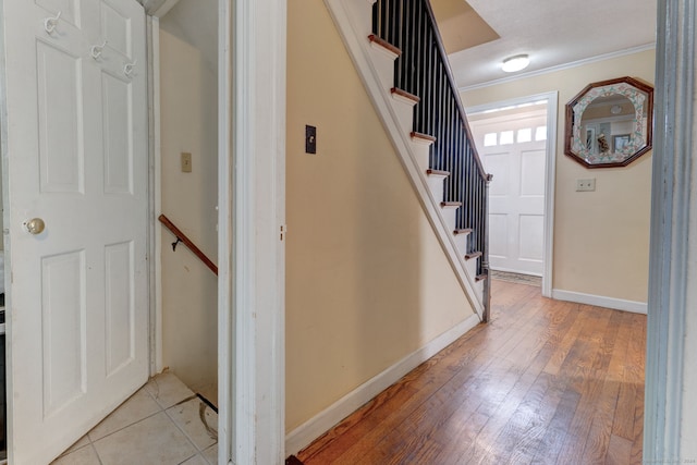 entrance foyer featuring light hardwood / wood-style floors and crown molding