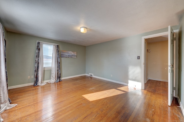 unfurnished room featuring light wood-type flooring