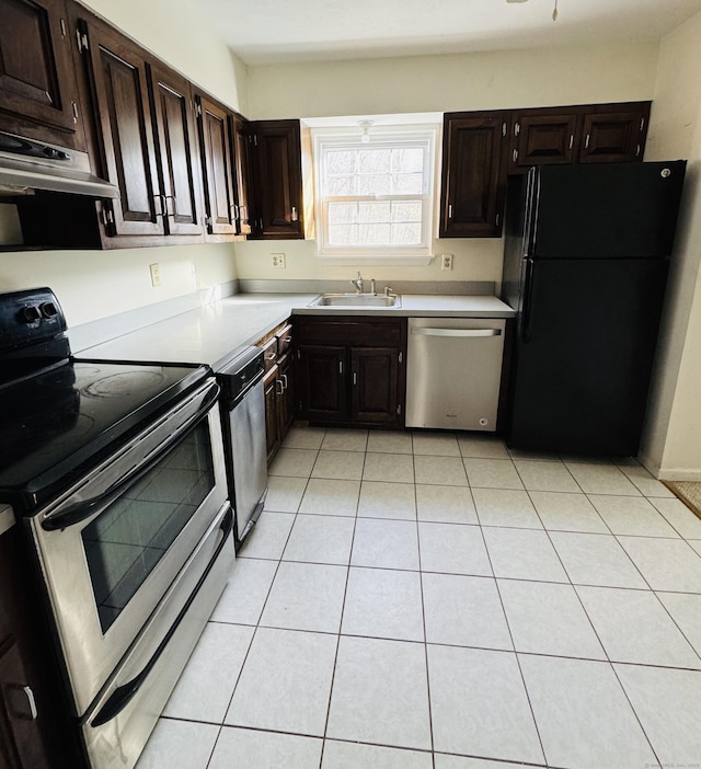 kitchen featuring dark brown cabinetry, ventilation hood, stainless steel appliances, sink, and light tile patterned flooring