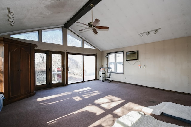 unfurnished living room with beam ceiling, track lighting, an AC wall unit, and ceiling fan