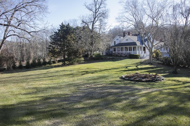 view of yard featuring a porch