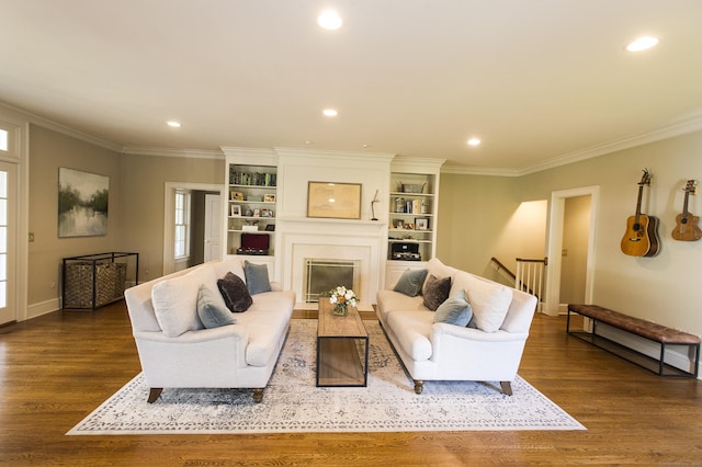 living room featuring a fireplace, dark hardwood / wood-style flooring, and ornamental molding