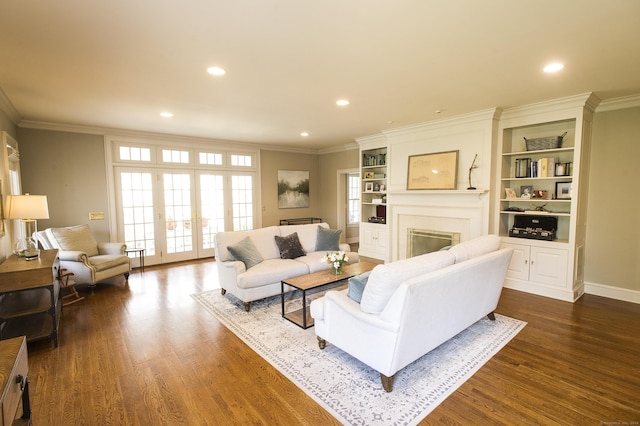 living room featuring french doors, dark hardwood / wood-style flooring, and ornamental molding