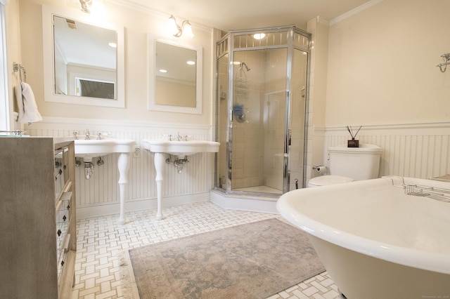 full bathroom with plus walk in shower, toilet, and crown molding