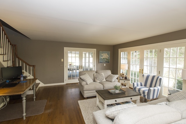 living room with french doors and dark hardwood / wood-style floors