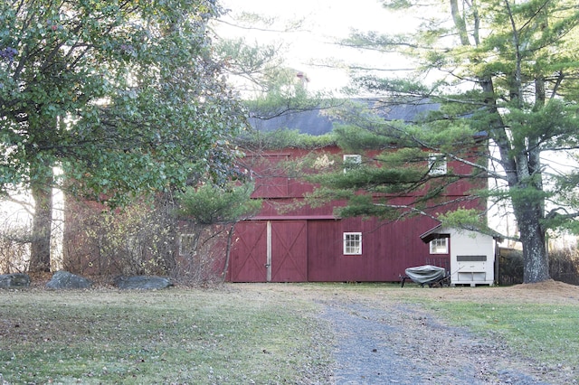 view of outbuilding featuring a yard