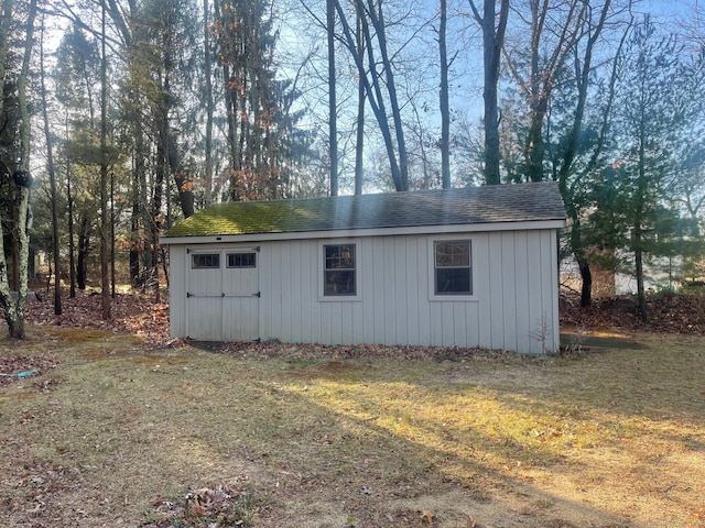 view of outdoor structure featuring a lawn