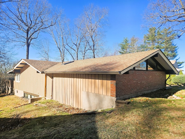 view of home's exterior with a yard