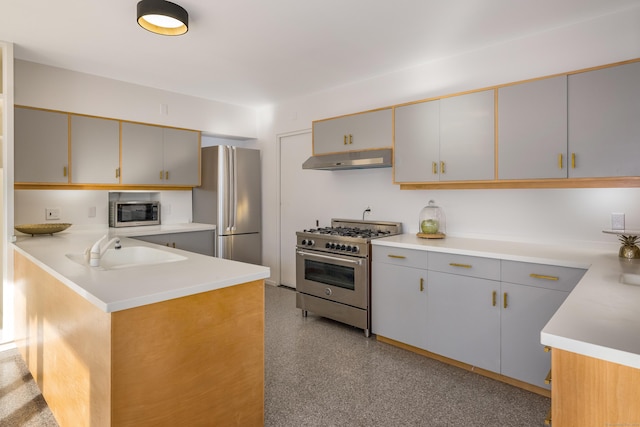 kitchen featuring sink, gray cabinets, appliances with stainless steel finishes, kitchen peninsula, and extractor fan