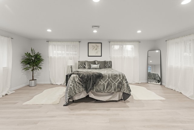 bedroom with light hardwood / wood-style floors